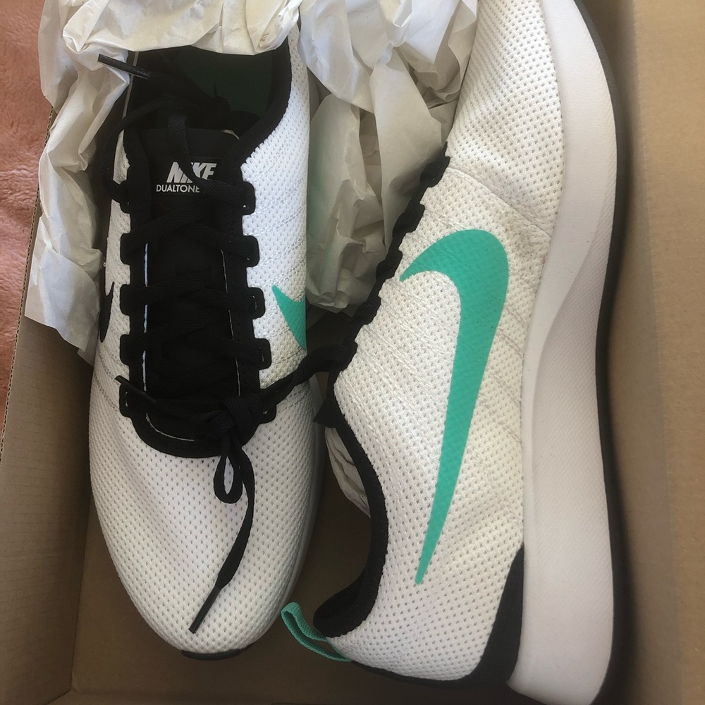 White Nike athletic shoes